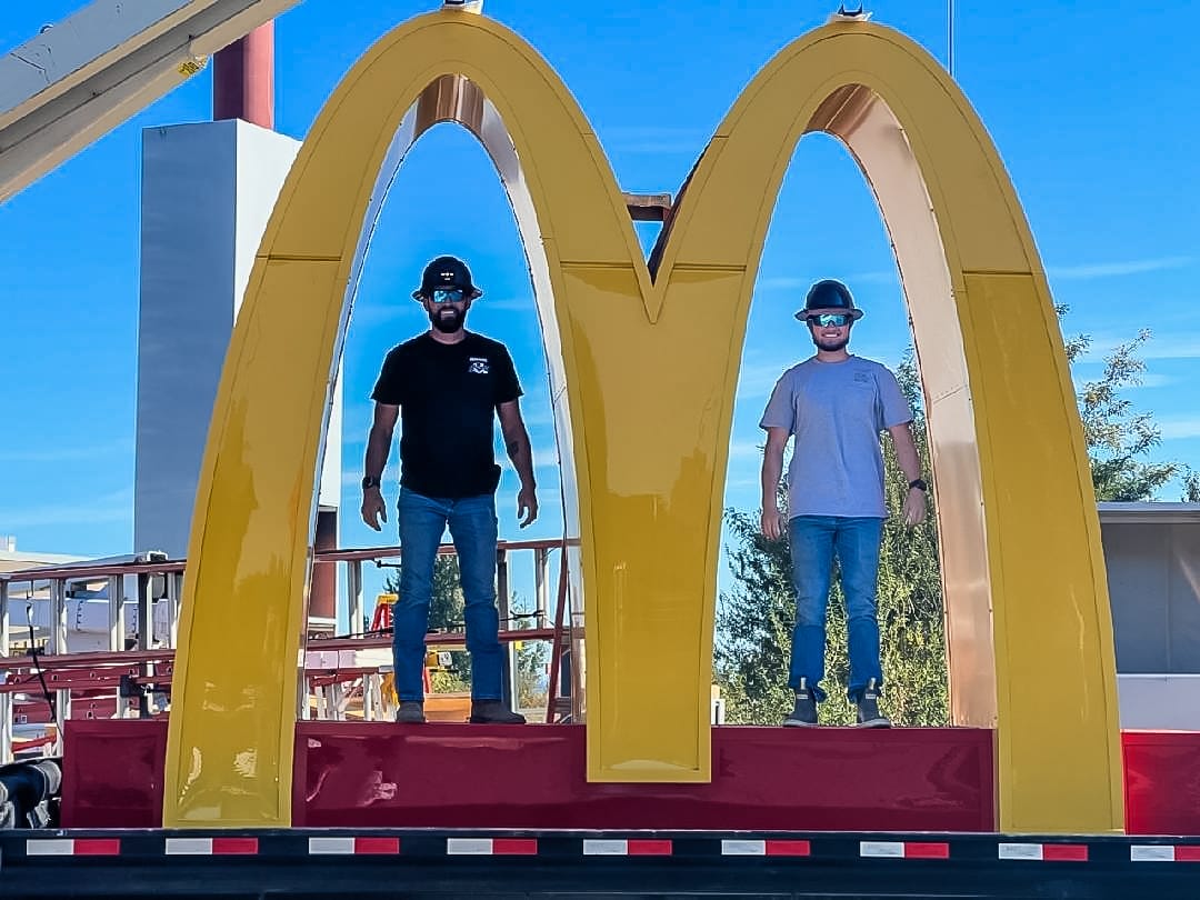 Dave and Jake Sams fabricating the McDonald's golden arches sign at the Advanced Electric Signs shop