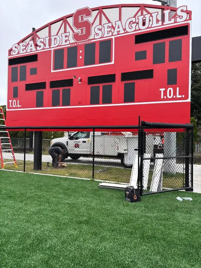 Outdoor football field scoreboard installation
